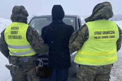 Funkcjonariusz Straży Granicznej i żołnierz WOT podczas wykonywania czynności służbowych Funkcjonariusz Straży Granicznej i żołnierz WOT podczas wykonywania czynności służbowych